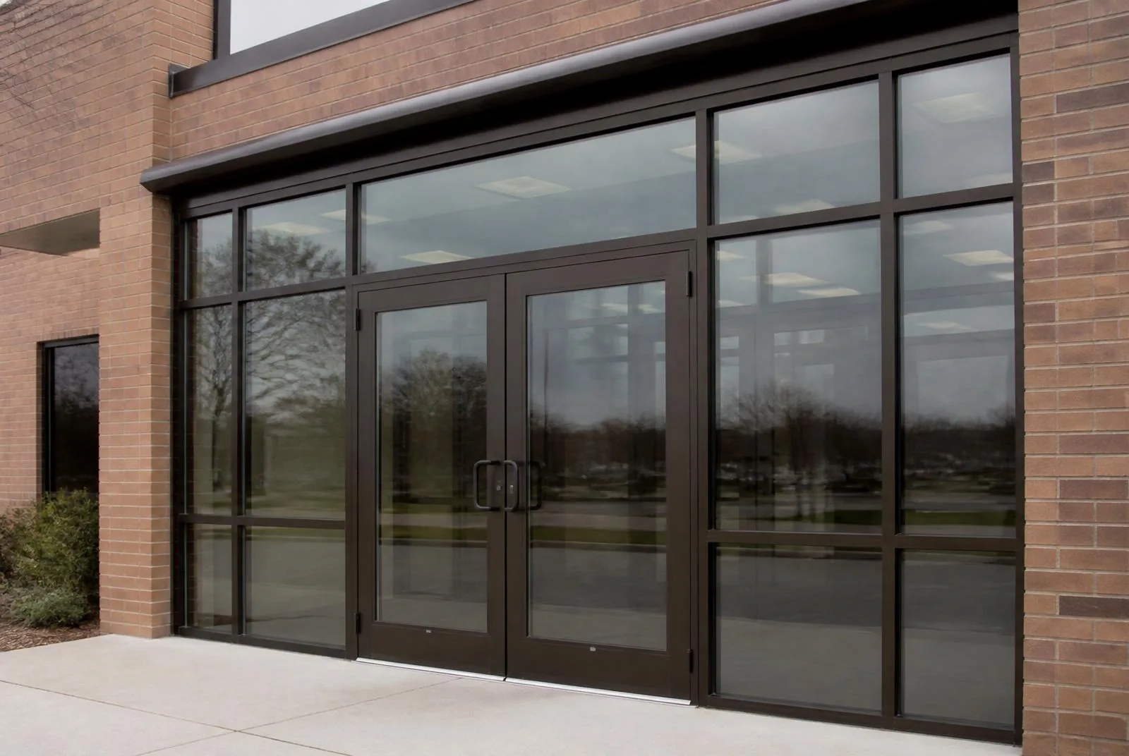 Aluminum entrance pair with transom and sidelites in a completed storefront